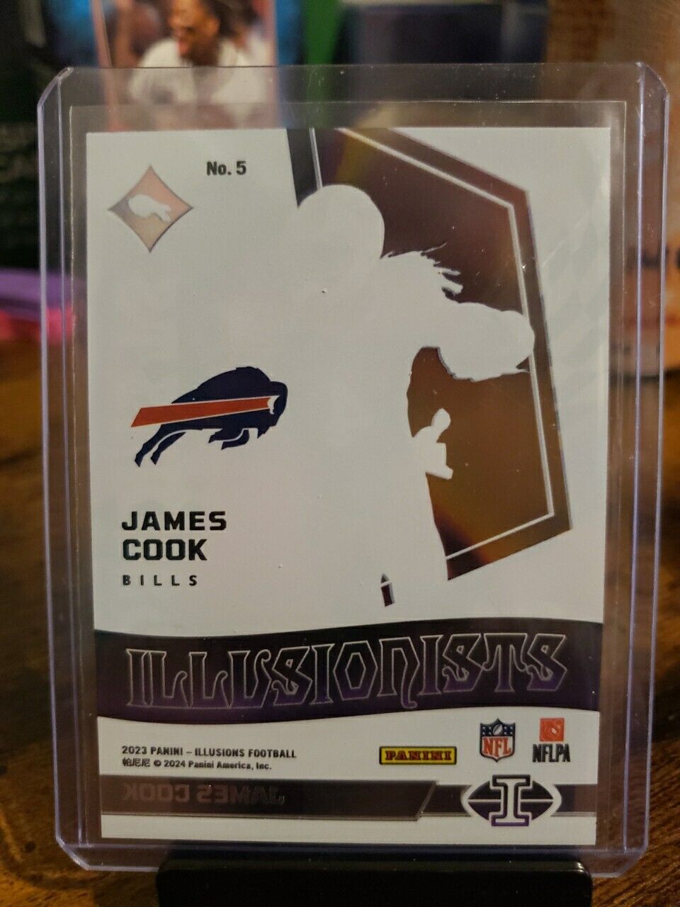 2023 Panini Illusions Football Illusionists Insert #5 - James Cook