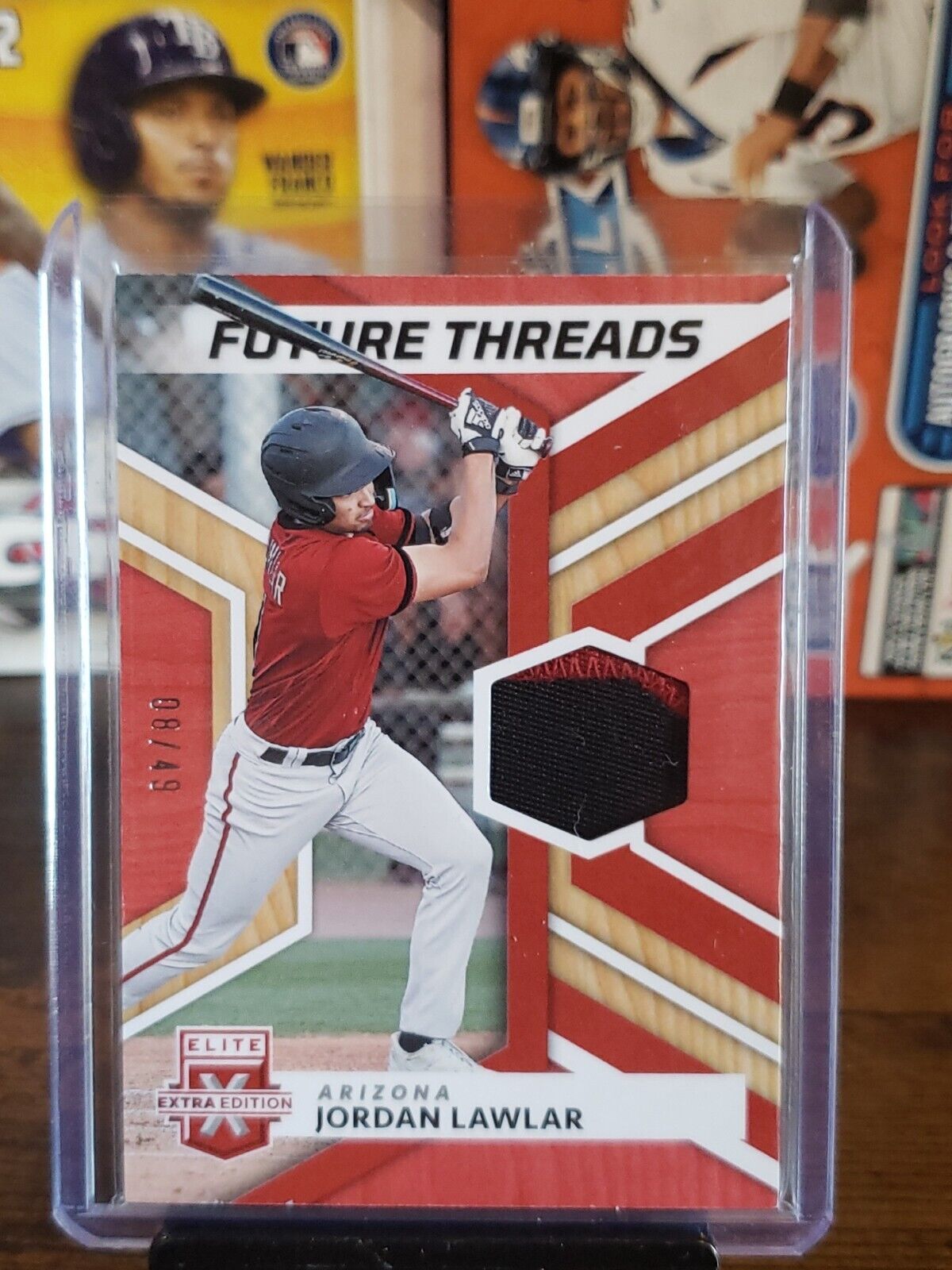 2022 Elite Extra Edition Future Threads Relic Red #FT-JL Jordan Lawlar /49